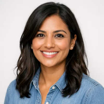 Photorealistic avatar portrait of a diverse adult with warm, friendly expression, studio background.